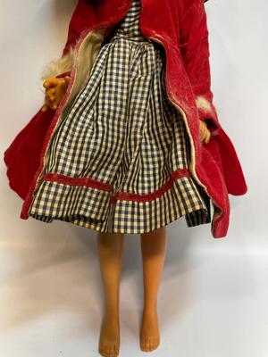 Vintage doll in red velvet jacket