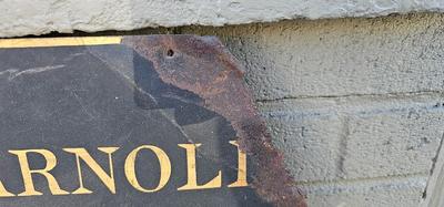 Rusty Shop Sign "Nellie L. Arnold Dress Making"