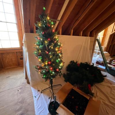 Sale Photo Thumbnail #1008: Includes 5ft tall multi-lit Christmas tree, 4 matching garlands, 2 holiday wreaths, and multiple stockings,
Decorative gift boxes, and box of Christmas lights.
Front gate Christmas tree tested and working, See picture.