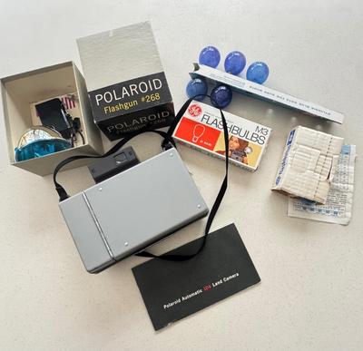 Vintage Polaroid with miscellaneous items - untested