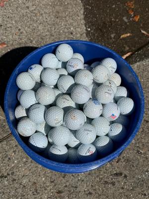 Bucket full of used Golf Balls