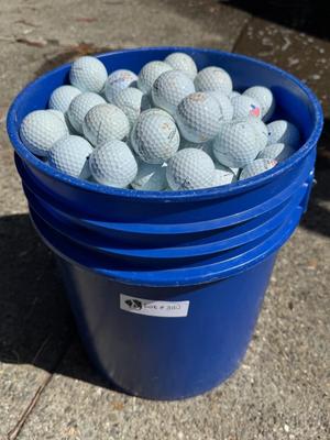 Bucket full of used Golf Balls