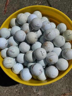 Bucket full of used Golf Balls