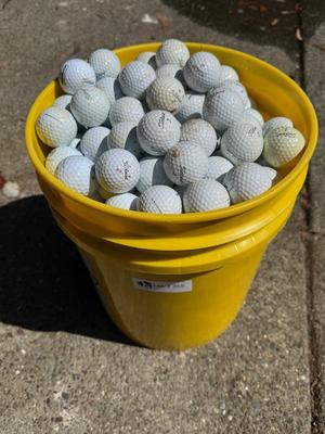Bucket full of used Golf Balls