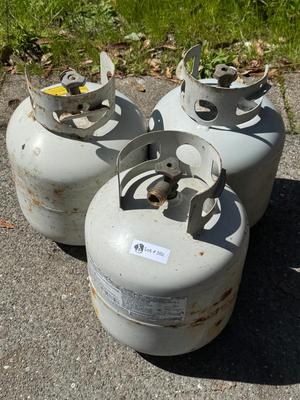 3 used Propane Tanks - 2 are full and 1 is half full