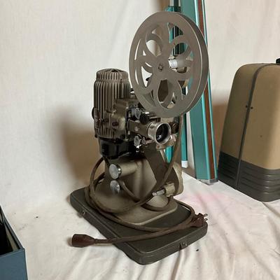 A1444 Vintage Bell & Howell 16mm Projector with Movie Reels & Wall Projector Screen