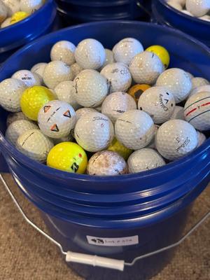 A Bucket full of used Golf Balls