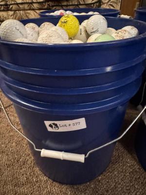 A bucket full of used Golf Balls