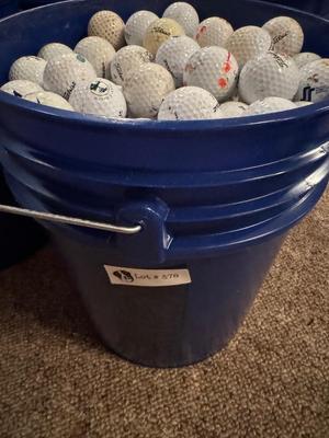 A bucket full of used Golf Balls