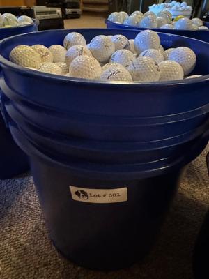 A bucket full of used Golf Balls