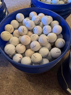 A bucket full of used Golf Balls