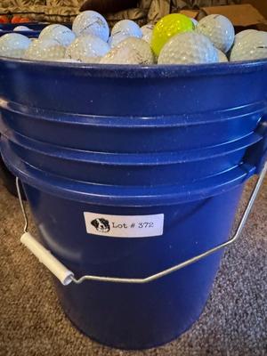 A bucket full of used Golf Balls