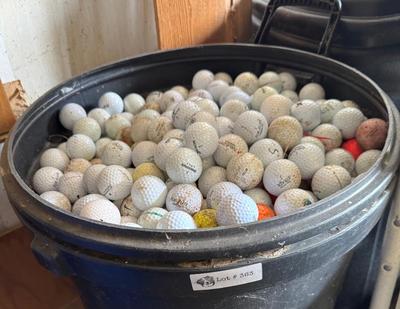 A 32 Gallon Can full of used Golf Balls