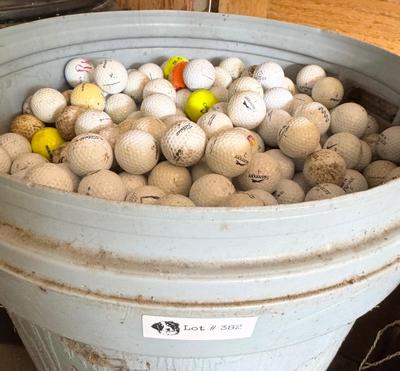 A 32 Gallon Can full of used Golf Balls