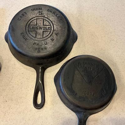 Sale Photo Thumbnail #1288: Griswold pan is a #5 
Large has no maker mark except #7 
Small is wagnerware