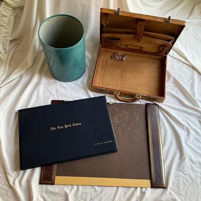 Sale Photo Thumbnail #1330: NYT in leather cover with desk mat, leather trash can and leather briefcase