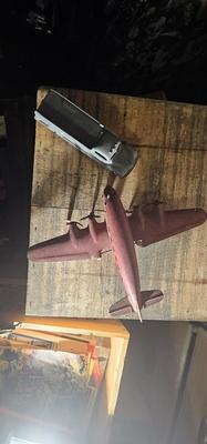 Vintage pressed metal toy truck and Marx airplane