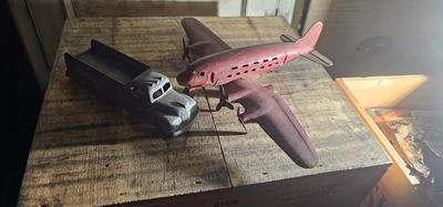 Vintage pressed metal toy truck and Marx airplane