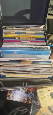 Metal box full of vintage Postcards