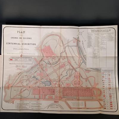 LOT 195: 1876 Philadelphia Centennial Exhibition Visitors Guide w/ Brass Eagle Flag Topper, Bailey Banks & Biddle Co. Miniature...