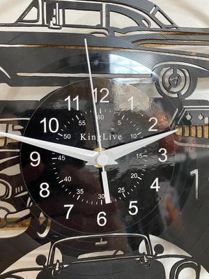 TIN JUKE BOX SIGN AND AN ACTUAL RECORD ALBUM CLOCK