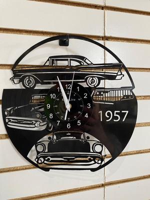 TIN JUKE BOX SIGN AND AN ACTUAL RECORD ALBUM CLOCK