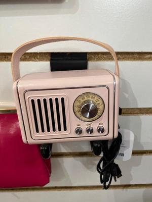 ROSIE THE RIVETER KEYCHAIN ALONG WITH HER DISTANT RELATIVES WINDOW STICKER, TIN FLAMINGO ROAD SIGN, AND MINI BLUETOOTH RADIO