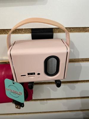 ROSIE THE RIVETER KEYCHAIN ALONG WITH HER DISTANT RELATIVES WINDOW STICKER, TIN FLAMINGO ROAD SIGN, AND MINI BLUETOOTH RADIO