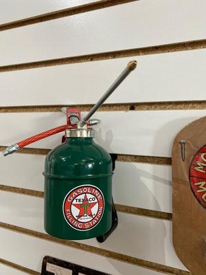 TEXACO ADVERTISING ITEMS, PLASTIC SIGN, OIL CAN AND TIN AND CAST IRON BOTTLE OPENER