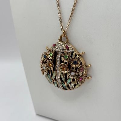 LOT 339J: Betsey Johnson Gold Tone Ladybug Pendant Necklace (32.5”)