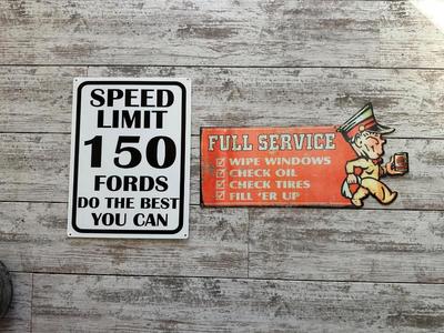 2 METAL/TIN SIGNS (2)