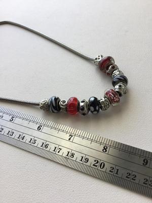 Beautiful unmarked red and black beaded fashion necklace