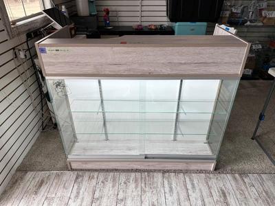 RETAIL CHECKOUT COUNTER WITH LIGHTED DISPLAY CASE