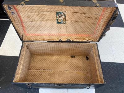 ANTIQUE TRUNK WITH BRASS ACCENTS
