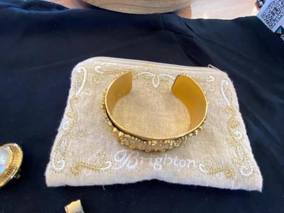 A VARIETY OF GOLD TONE WATCHES, JEWELRY AND A BELT BUCKLE
