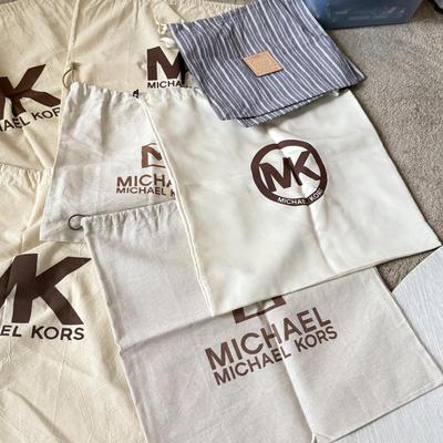 LOT 413L: Collection of Designer Bag Dust Covers: Michael Kors, Coach, Betsey Johnson, Dooney & Bourke