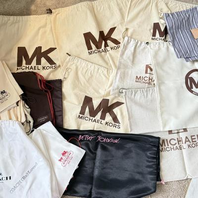 LOT 413L: Collection of Designer Bag Dust Covers: Michael Kors, Coach, Betsey Johnson, Dooney & Bourke