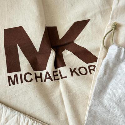 LOT 413L: Collection of Designer Bag Dust Covers: Michael Kors, Coach, Betsey Johnson, Dooney & Bourke