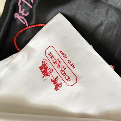 LOT 413L: Collection of Designer Bag Dust Covers: Michael Kors, Coach, Betsey Johnson, Dooney & Bourke