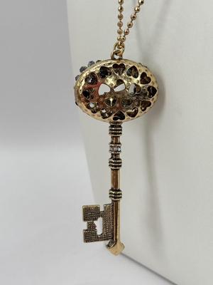 LOT 347J: 34” Betsey Johnson Gold Tone Ornate Key Pendant Necklace