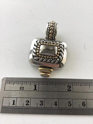 Silver tone necklace pendant