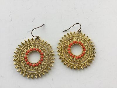 Gold tone round statement earrings