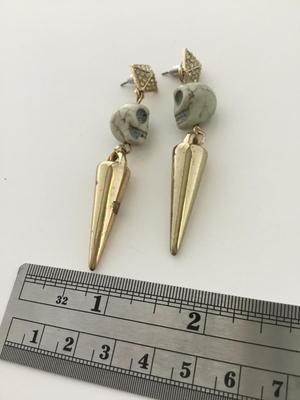 Gold tone skull fashion dangle earrings