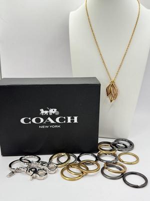 LOT 460J: 18” Coach Gold Tone Necklace, Coach Key Rings (18) & Gift Box