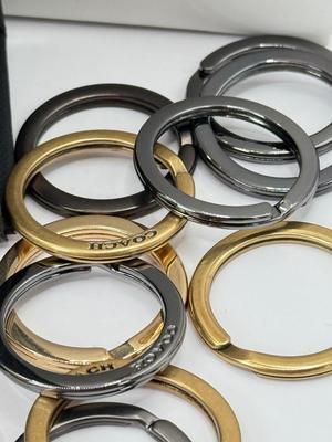 LOT 460J: 18” Coach Gold Tone Necklace, Coach Key Rings (18) & Gift Box