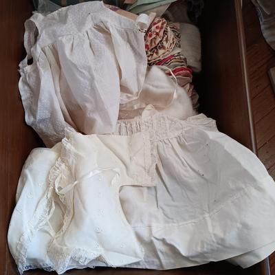 LOT 205: Vintage Baby Clothes, Wooden Cradle & More