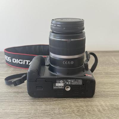 LOT 81K: Canon EOS Rebel XSI DSLR Camera Body w/ Attatched Lens, Manual & Battery Charger
