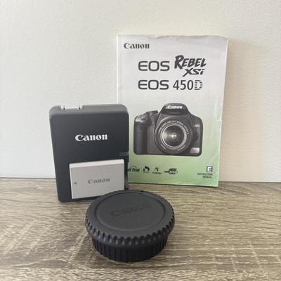 LOT 81K: Canon EOS Rebel XSI DSLR Camera Body w/ Attatched Lens, Manual & Battery Charger