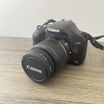 LOT 81K: Canon EOS Rebel XSI DSLR Camera Body w/ Attatched Lens, Manual & Battery Charger