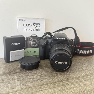 LOT 81K: Canon EOS Rebel XSI DSLR Camera Body w/ Attatched Lens, Manual & Battery Charger